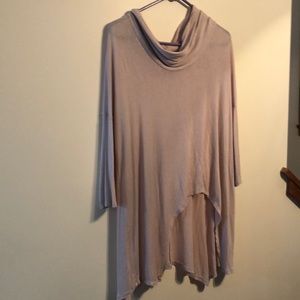 Jennifer Lopez pink loose necked blouse